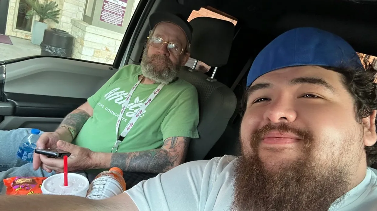 A selfie of Jonathan and Kevin in the truck