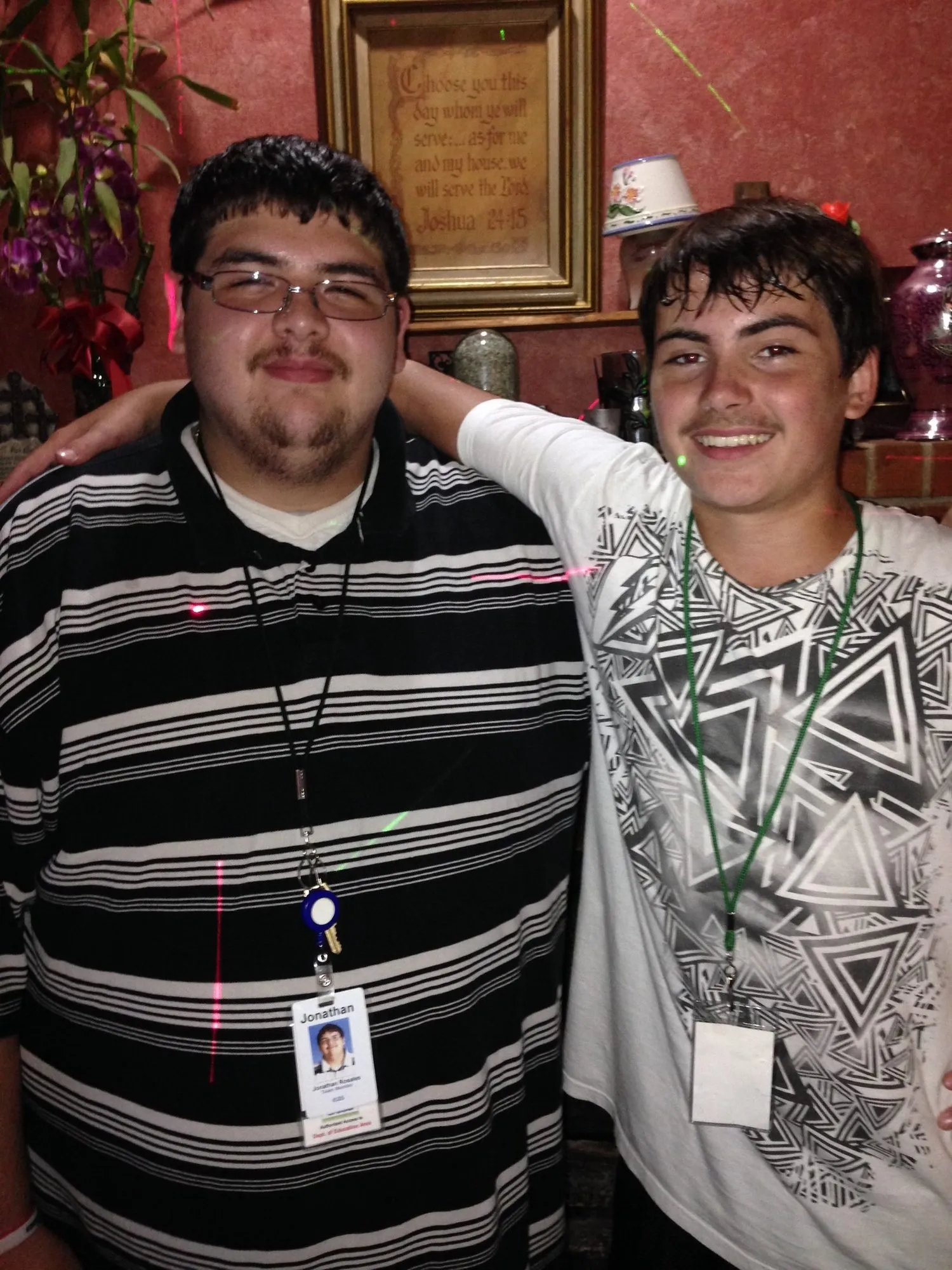 Two Young Rebels wearing VIP name tag lanyards