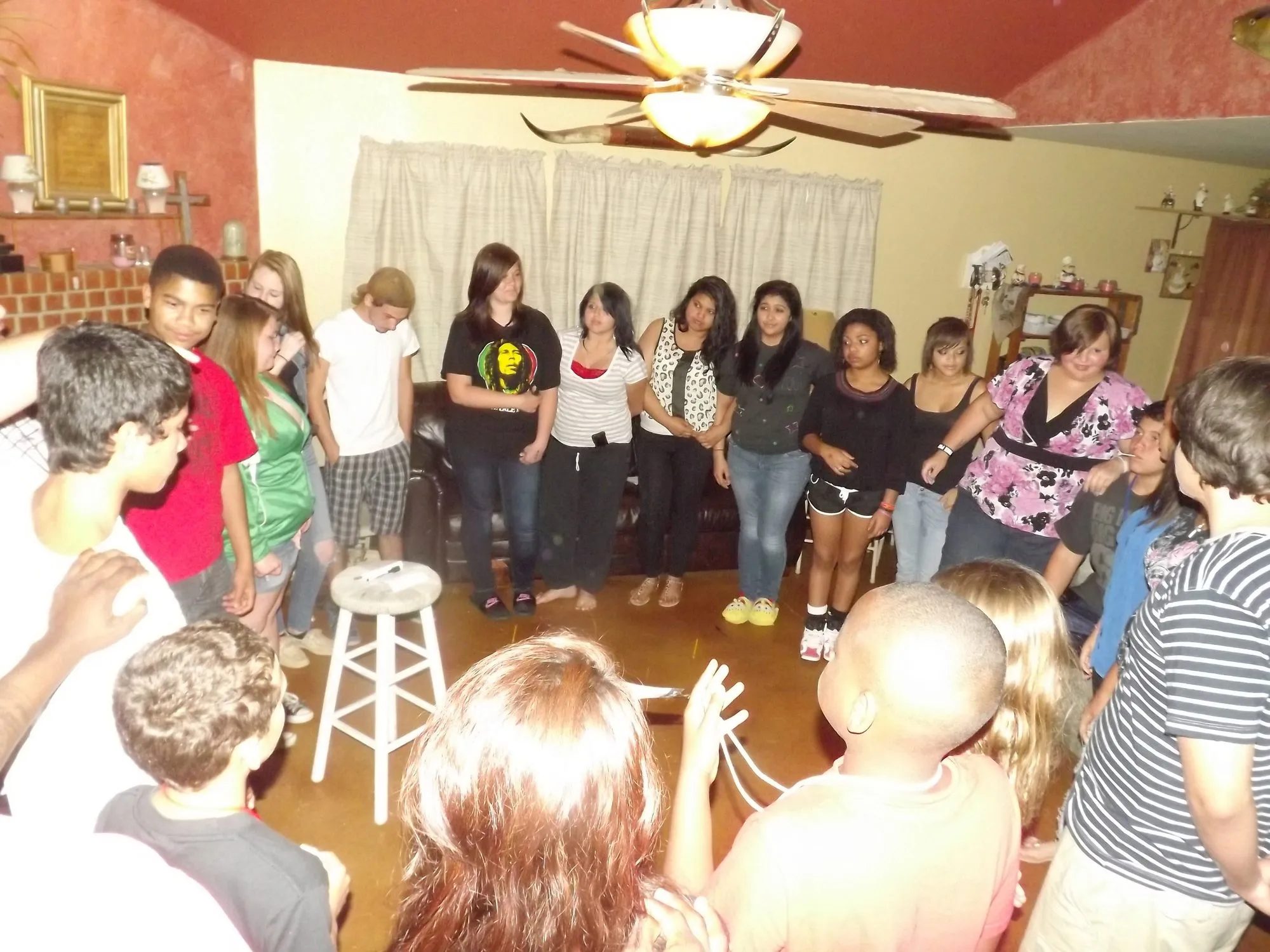 Young Rebels gathered around the room